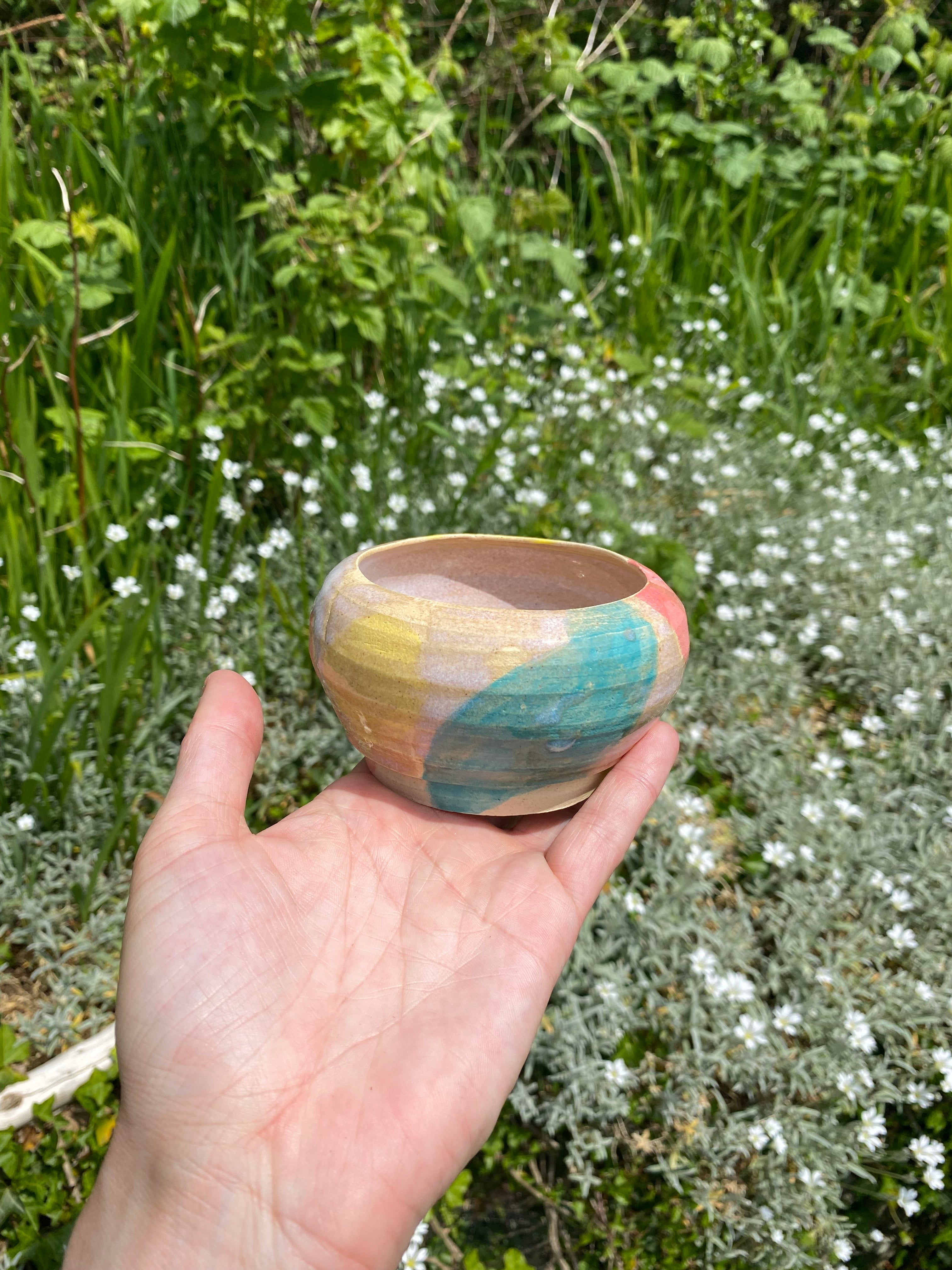 Soft focus, candy colors, textured vessel, planter, sauce bowl.