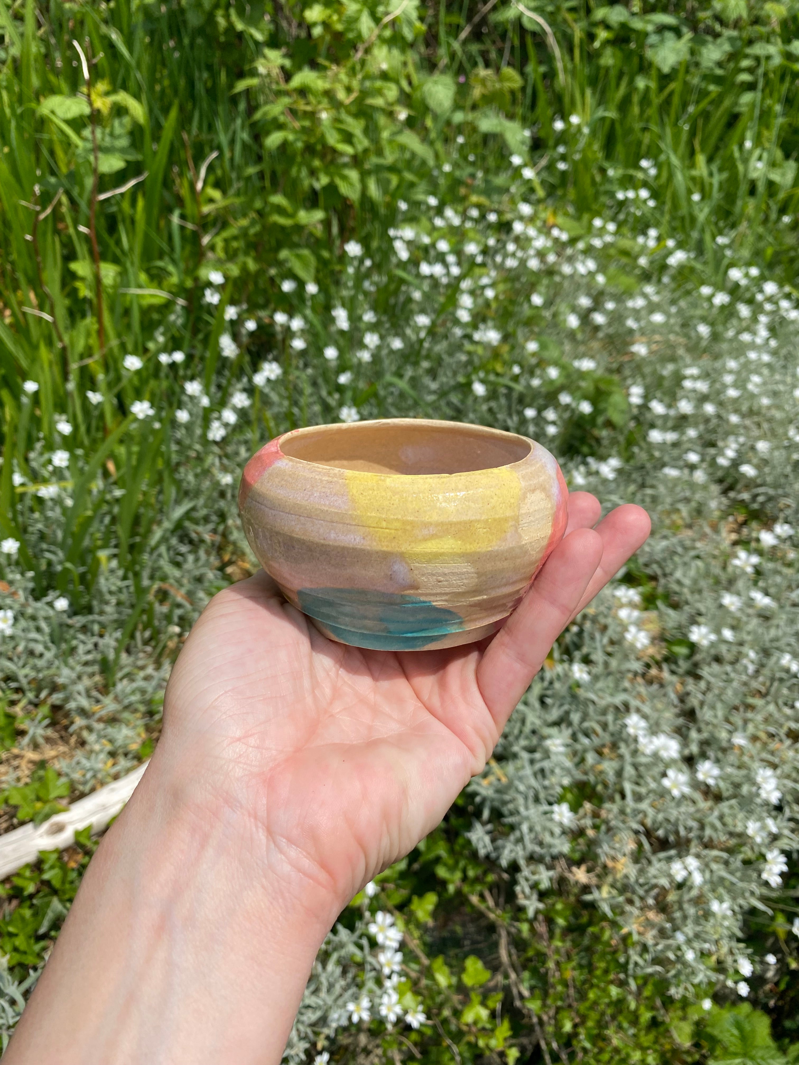 Soft focus, candy colors, textured vessel, planter, sauce bowl.